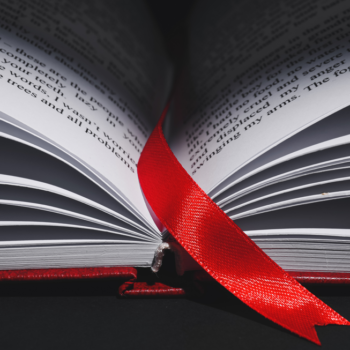 image of open book with red bookmark